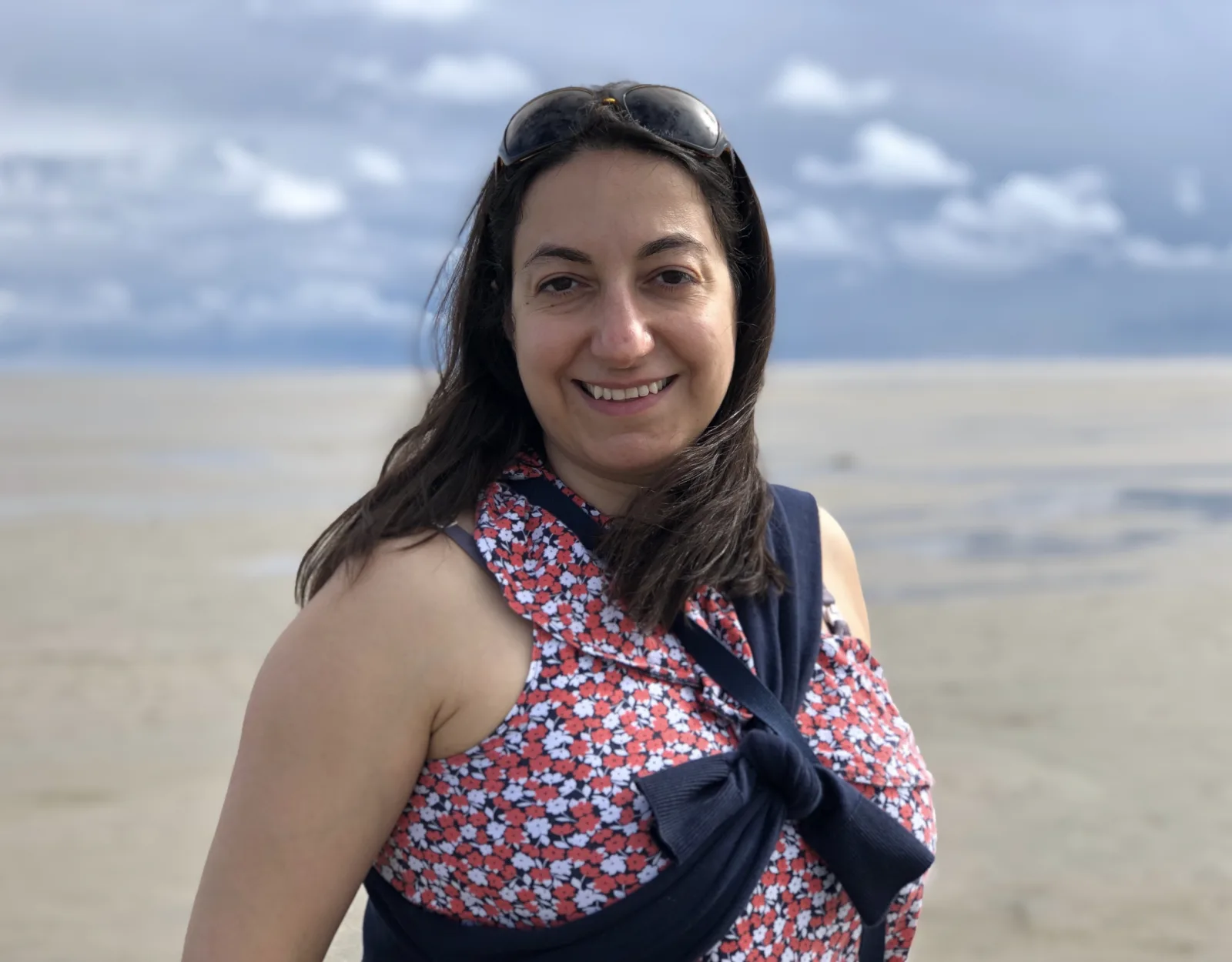 Sara, piano and voice teacher, smiling outdoors